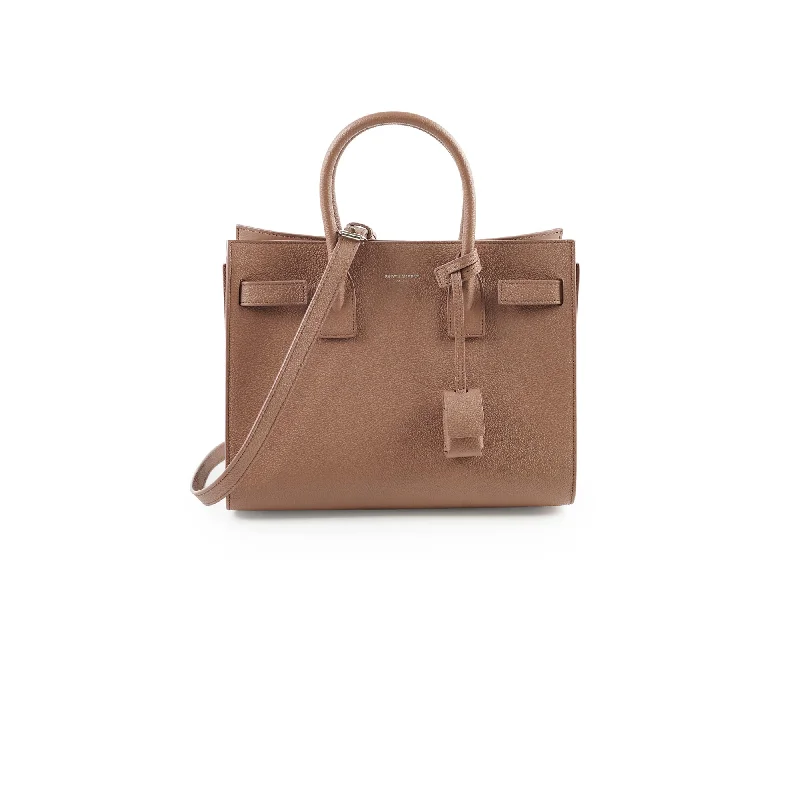 Waterproof vinyl handle bags shielding gear from rain -Saint Laurent Sac De Jour Baby Pink/Dark Beige