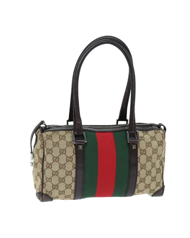 Flexible knit handle bags stretching for extra space -GG Canvas Web Sherry Line Hand Bag with Red and Green Accents