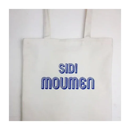 Sleek cobalt handle bags popping with blue hues -Sidi Moumen Tote Bag