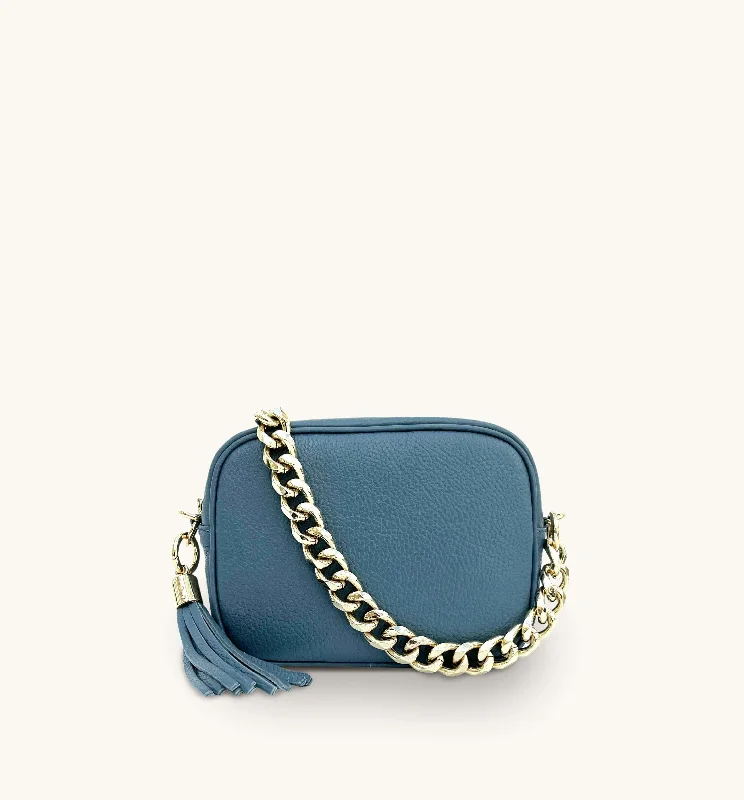 Metallic silver crossbody bags gleaming at dance parties -The Tassel Denim Blue Leather Crossbody Bag With Gold Chain Strap