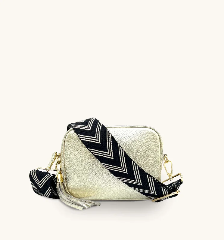 Metallic silver crossbody bags gleaming at dance parties -The Tassel Gold Leather Crossbody Bag With Black & Stone Arrow Strap