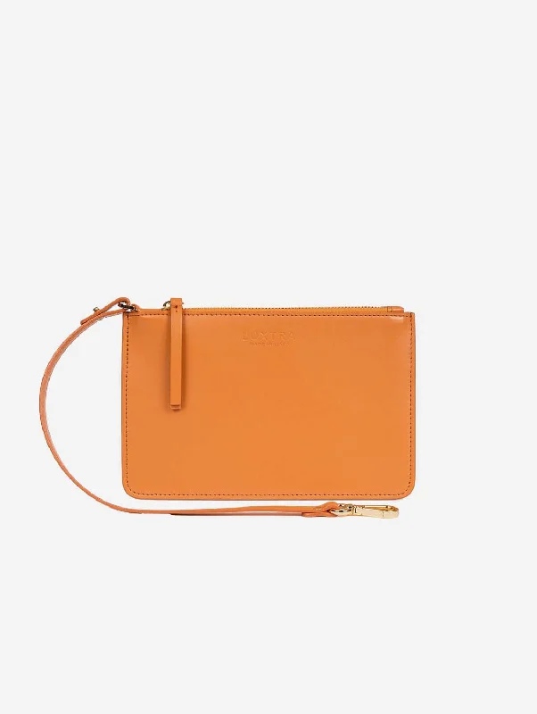 Fashion-forward evening clutches with geometric designs for a bold and unique look -The Junko Apple Leather Vegan Pouch |  Pumpkin